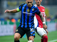 Lautaro Martinez of FC Internazionale and Ben White of Arsenal compete for the ball during the UEFA Champions League 2024/25 League Phase MD...