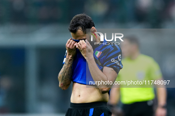 Hakan Calhanoglu of FC Internazionale looks dejected during the UEFA Champions League 2024/25 League Phase MD4 match between FC Internaziona...