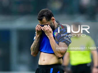 Hakan Calhanoglu of FC Internazionale looks dejected during the UEFA Champions League 2024/25 League Phase MD4 match between FC Internaziona...