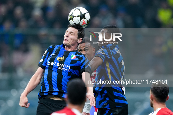 Benjamin Pavard of FC Internazionale and Denzel Dumfries of FC Internazionale jump for the ball during the UEFA Champions League 2024/25 Lea...