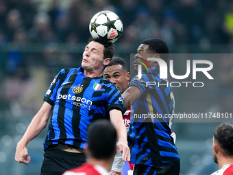 Benjamin Pavard of FC Internazionale and Denzel Dumfries of FC Internazionale jump for the ball during the UEFA Champions League 2024/25 Lea...