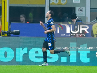 Hakan Calhanoglu of FC Internazionale celebrates after scoring first goal during the UEFA Champions League 2024/25 League Phase MD4 match be...