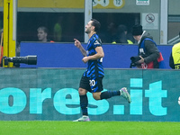 Hakan Calhanoglu of FC Internazionale celebrates after scoring first goal during the UEFA Champions League 2024/25 League Phase MD4 match be...