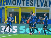 Hakan Calhanoglu of FC Internazionale celebrates after scoring first goal during the UEFA Champions League 2024/25 League Phase MD4 match be...