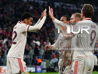 Jamal Musiala of Bayern Munich  celebrates the teams first goal during the Champions League Round 4 match between Bayern Munich v Benfica at...