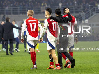 Oleksandr Zinchenko, Gabriel Martinelli, Mikel Arteta, and Thomas Partey play during the UEFA Champions League 2024/25 match between FC Inte...