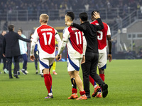 Oleksandr Zinchenko, Gabriel Martinelli, Mikel Arteta, and Thomas Partey play during the UEFA Champions League 2024/25 match between FC Inte...