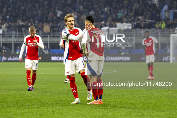 Gabriel Martinelli and Martin Odegaard play during the UEFA Champions League 2024/25 match between FC Internazionale and FC Arsenal in Milan...