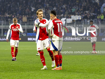 Gabriel Martinelli and Martin Odegaard play during the UEFA Champions League 2024/25 match between FC Internazionale and FC Arsenal in Milan...