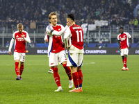 Gabriel Martinelli and Martin Odegaard play during the UEFA Champions League 2024/25 match between FC Internazionale and FC Arsenal in Milan...