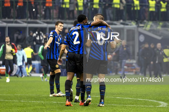 Denzel Dumfries and Stefan De Vrij play during the UEFA Champions League 2024/25 match between FC Internazionale and FC Arsenal in Milano, I...