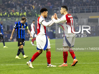 Ethan Nwaneri and Gabriel Martinelli play during the UEFA Champions League 2024/25 match between FC Internazionale and FC Arsenal in Milano,...