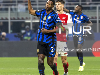 Denzel Dumfries plays during the UEFA Champions League 2024/25 match between FC Internazionale and FC Arsenal at Stadio Giuseppe Meazza in M...