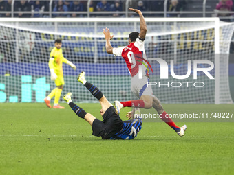 Gabriel Jesus and Nicolo Barella are in action during the UEFA Champions League 2024/25 match between FC Internazionale and FC Arsenal in Mi...