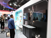 Visitors watch an introduction of the game ''Black Myth: Wukong'' at the 7th China International Import Expo in Shanghai, China, on November...