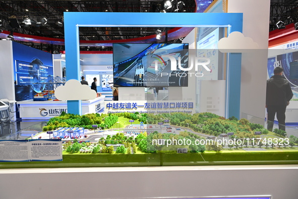 A model of the China-Vietnam Friendship Pass - Friendship Smart Port project is displayed at the 7th China International Import Expo in Shan...