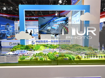 A model of the China-Vietnam Friendship Pass - Friendship Smart Port project is displayed at the 7th China International Import Expo in Shan...