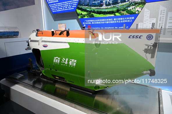 A model of the 1:6 ''Fighter'' all-sea deep-sea manned submersible is displayed at the China Pavilion at the 7th China International Import...