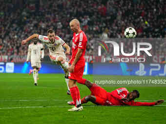 Joshua Kimmich of Bayern Munich  shoots on goal during the Champions League Round 4 match between Bayern Munich v Benfica at the Allianz are...