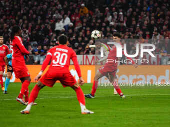 Kingsley Coman of Bayern Munich  shoots on goal during the Champions League Round 4 match between Bayern Munich v Benfica at the Allianz are...