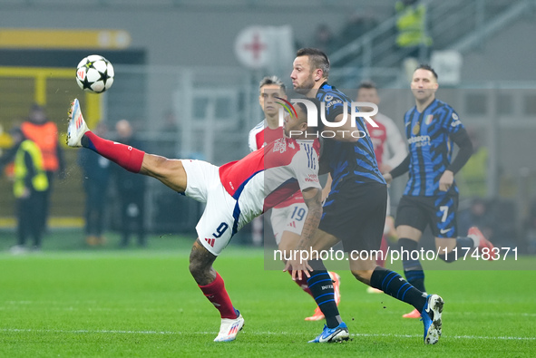 Gabriel Jesus of Arsenal and Stefan de Vrij of FC Internazionale compete for the ball during the UEFA Champions League 2024/25 League Phase...