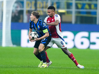 Nicolo' Barella of FC Internazionale and Gabriel Jesus of Arsenal compete for the ball during the UEFA Champions League 2024/25 League Phase...