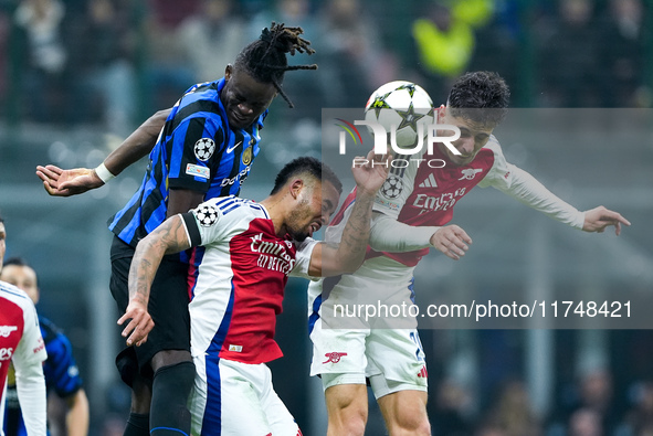 Kai Havertz of Arsenal and Yann Aurel Bisseck of FC Internazionale jump for the ball during the UEFA Champions League 2024/25 League Phase M...