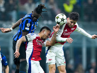 Kai Havertz of Arsenal and Yann Aurel Bisseck of FC Internazionale jump for the ball during the UEFA Champions League 2024/25 League Phase M...