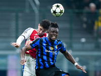 Kai Havertz of Arsenal and Yann Aurel Bisseck of FC Internazionale jump for the ball during the UEFA Champions League 2024/25 League Phase M...