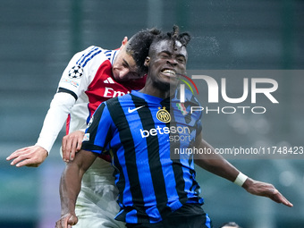 Kai Havertz of Arsenal and Yann Aurel Bisseck of FC Internazionale jump for the ball during the UEFA Champions League 2024/25 League Phase M...