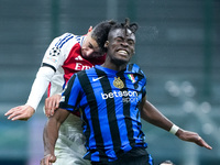 Kai Havertz of Arsenal and Yann Aurel Bisseck of FC Internazionale jump for the ball during the UEFA Champions League 2024/25 League Phase M...