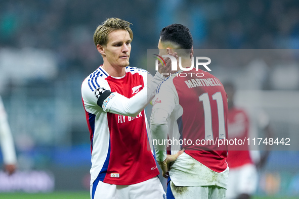 Martin Odegaard of Arsenal consoles Gabriel Martinelli of Arsenal during the UEFA Champions League 2024/25 League Phase MD4 match between FC...