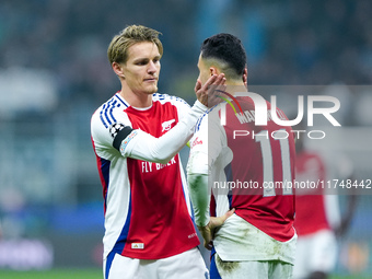 Martin Odegaard of Arsenal consoles Gabriel Martinelli of Arsenal during the UEFA Champions League 2024/25 League Phase MD4 match between FC...