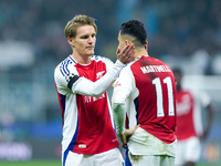 Martin Odegaard of Arsenal consoles Gabriel Martinelli of Arsenal during the UEFA Champions League 2024/25 League Phase MD4 match between FC...