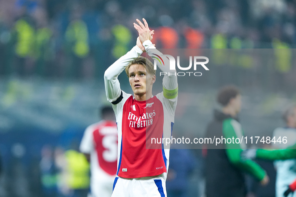 Martin Odegaard of Arsenal greets the fans during the UEFA Champions League 2024/25 League Phase MD4 match between FC Internazionale and Ars...