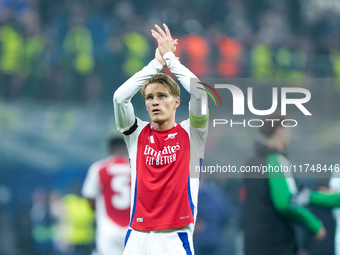 Martin Odegaard of Arsenal greets the fans during the UEFA Champions League 2024/25 League Phase MD4 match between FC Internazionale and Ars...