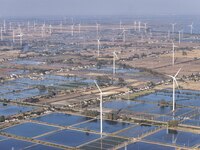 An aerial photo shows a new energy wind power generation near Gaoyou Lake in Taji town of Huai'an City, East China's Jiangsu province, on No...