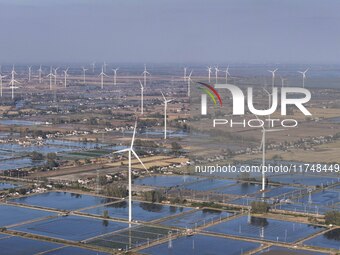 An aerial photo shows a new energy wind power generation near Gaoyou Lake in Taji town of Huai'an City, East China's Jiangsu province, on No...