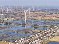 An aerial photo shows a new energy wind power generation near Gaoyou Lake in Taji town of Huai'an City, East China's Jiangsu province, on No...