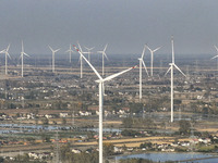 An aerial photo shows a new energy wind power generation near Gaoyou Lake in Taji town of Huai'an City, East China's Jiangsu province, on No...