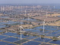 An aerial photo shows a new energy wind power generation near Gaoyou Lake in Taji town of Huai'an City, East China's Jiangsu province, on No...