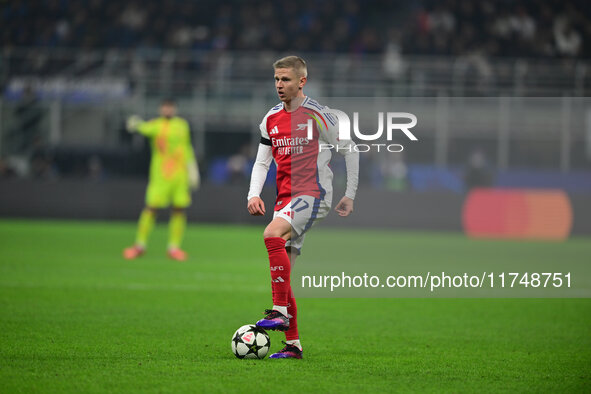 Oleksandr Zinchenko of Arsenal is in action during the Champions League match between Inter Milan and Arsenal at San Siro Stadium in Milan,...