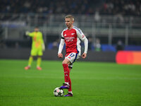 Oleksandr Zinchenko of Arsenal is in action during the Champions League match between Inter Milan and Arsenal at San Siro Stadium in Milan,...