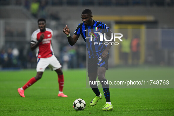 Marcos Thuram of Inter Milan is in action during the Champions League match between Inter Milan and Arsenal at San Siro Stadium in Milan, It...