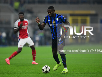 Marcos Thuram of Inter Milan is in action during the Champions League match between Inter Milan and Arsenal at San Siro Stadium in Milan, It...