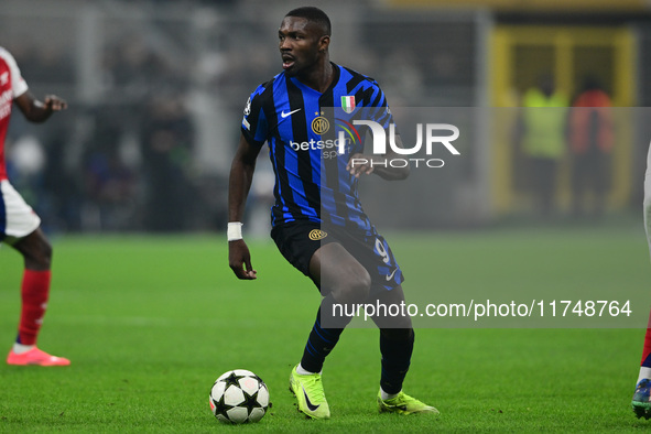 Marcos Thuram of Inter Milan is in action during the Champions League match between Inter Milan and Arsenal at San Siro Stadium in Milan, It...