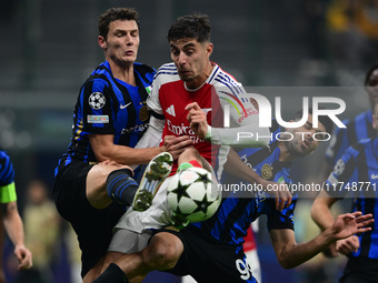 Benjamin Savard of Inter Milan and Kai Havertz of Arsenal battle for the ball during the Champions League match between Inter Milan and Arse...