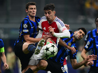 Benjamin Savard of Inter Milan and Kai Havertz of Arsenal battle for the ball during the Champions League match between Inter Milan and Arse...