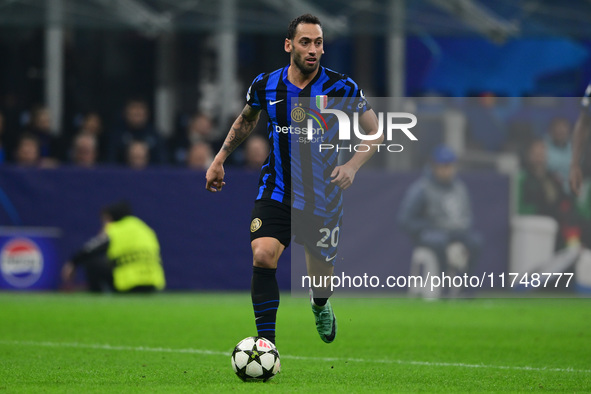 Hakan Calhanoglu of Inter Milan is in action during the Champions League match between Inter Milan and Arsenal at San Siro Stadium in Milan,...