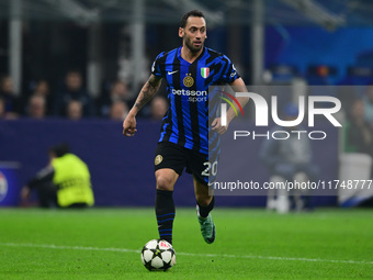 Hakan Calhanoglu of Inter Milan is in action during the Champions League match between Inter Milan and Arsenal at San Siro Stadium in Milan,...